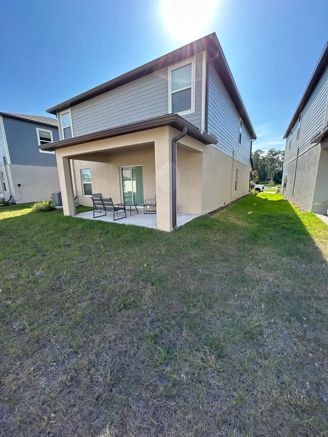 Musket Brown gutter and downspout on the covered rear patio of a Zephyrhills FL home