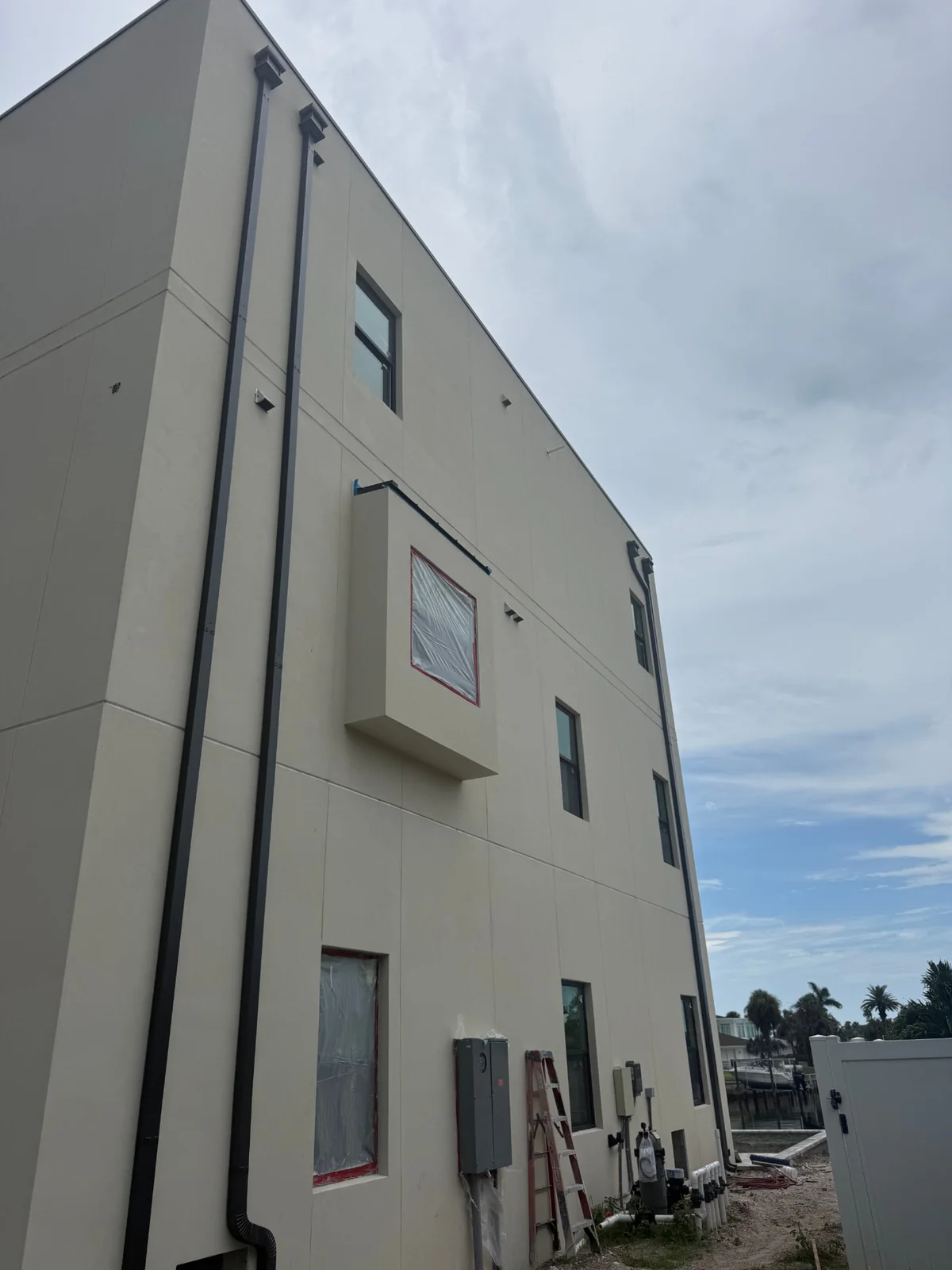 New gutter installation on a commercial property during construction