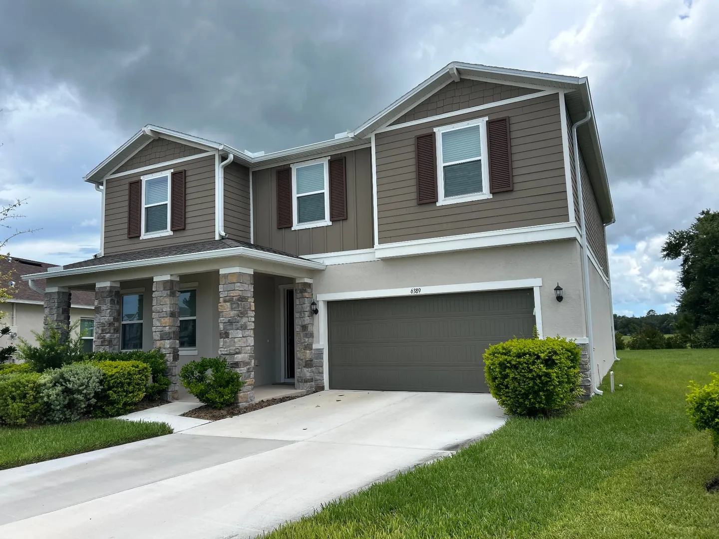 6-inch seamless K-style gutters on a two-story shingle-roof home in Land O' Lakes FL