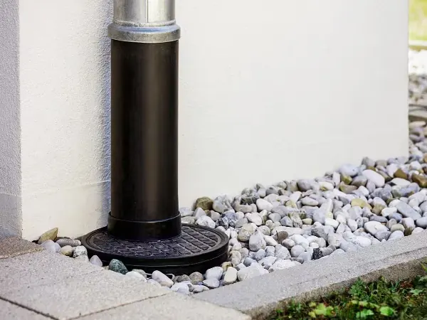 French drain trench being installed in a Florida yard