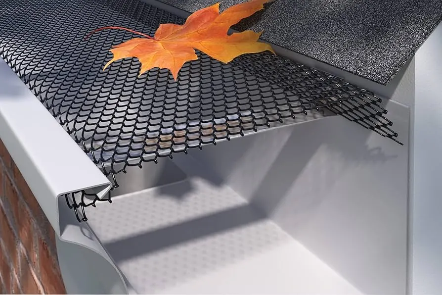 Gutter guard installed over a seamless aluminum gutter
