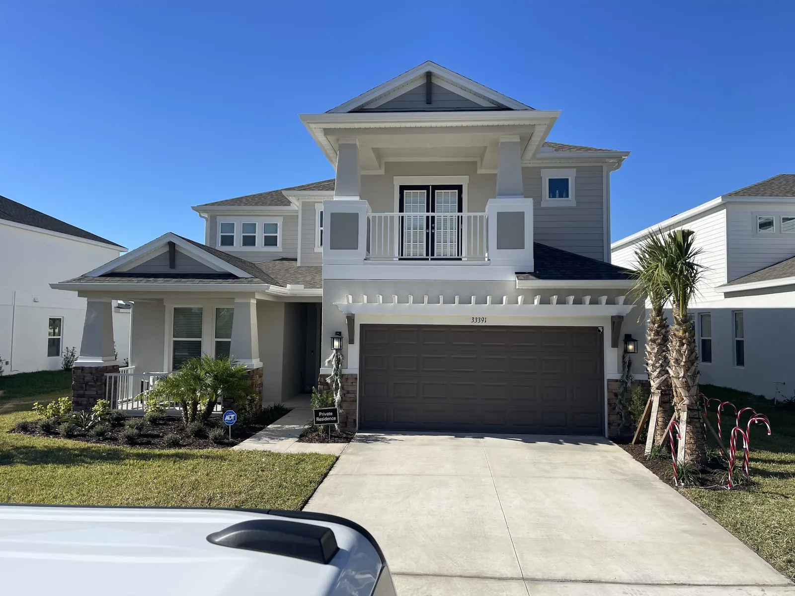 Florida home with newly installed seamless aluminum gutters and downspouts